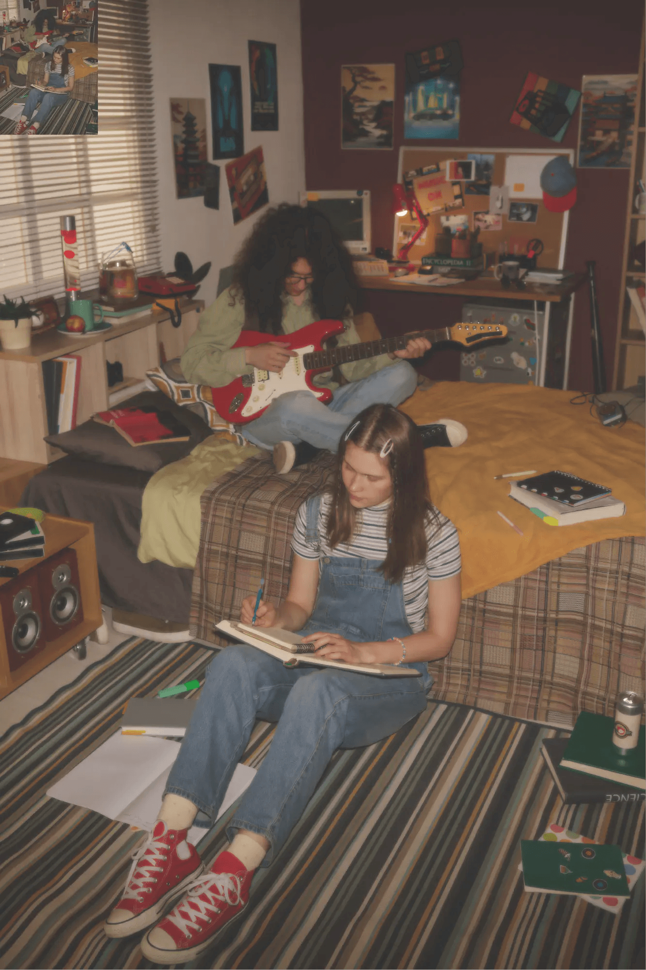 Two artists writing music in a bedroom studio